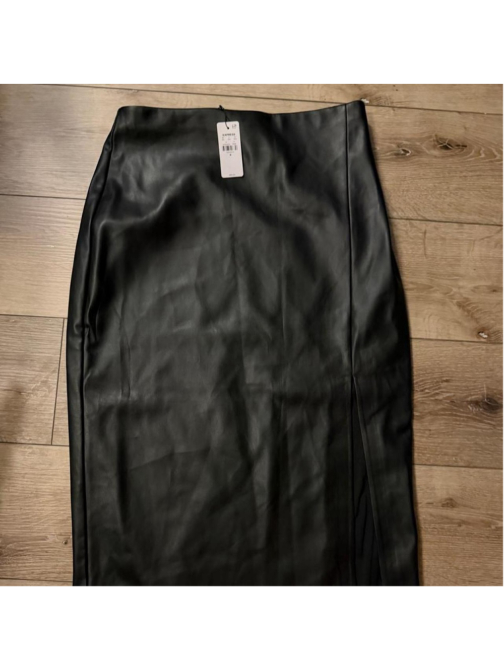 Black faux leather maxi skirt with a sleek longline silhouette